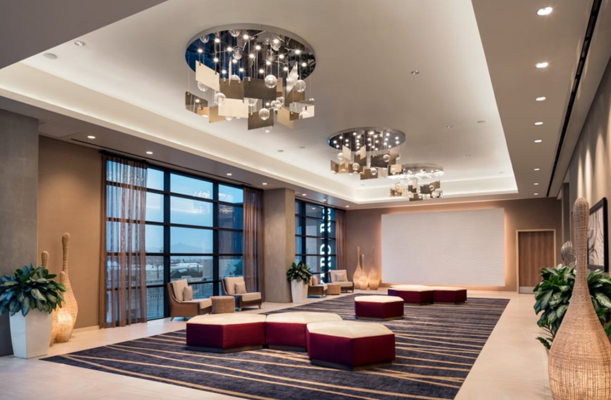 Encanto Pre-Function lounge with chandeliers and floor-to-ceiling windows